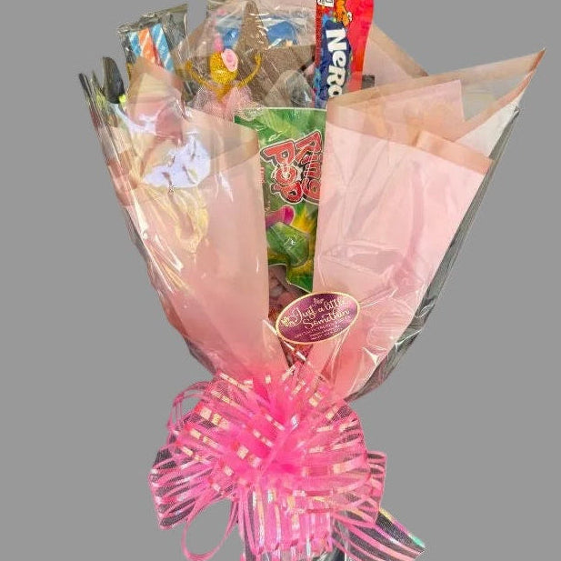 Bouquet of wrapped candy and chocolate. Designs may vary.