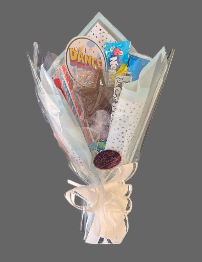 Wrapped  candy and chocolate in a bouquet. Designs may vary.